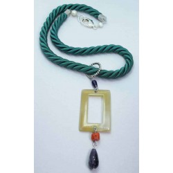 Green silk necklace with amethyst, carved bone and red coral. Closure with freshwater pearls